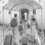 Graphite illustration of guests walking up the gangway to board Icon of the Seas on embarkation day